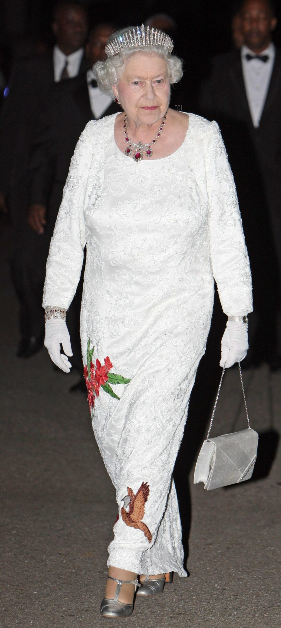 Queen Elizabeth II walking in the grounds of President George Maxwell Richards' official residence in Trinidad before a State Dinner, 26 Nov 2009