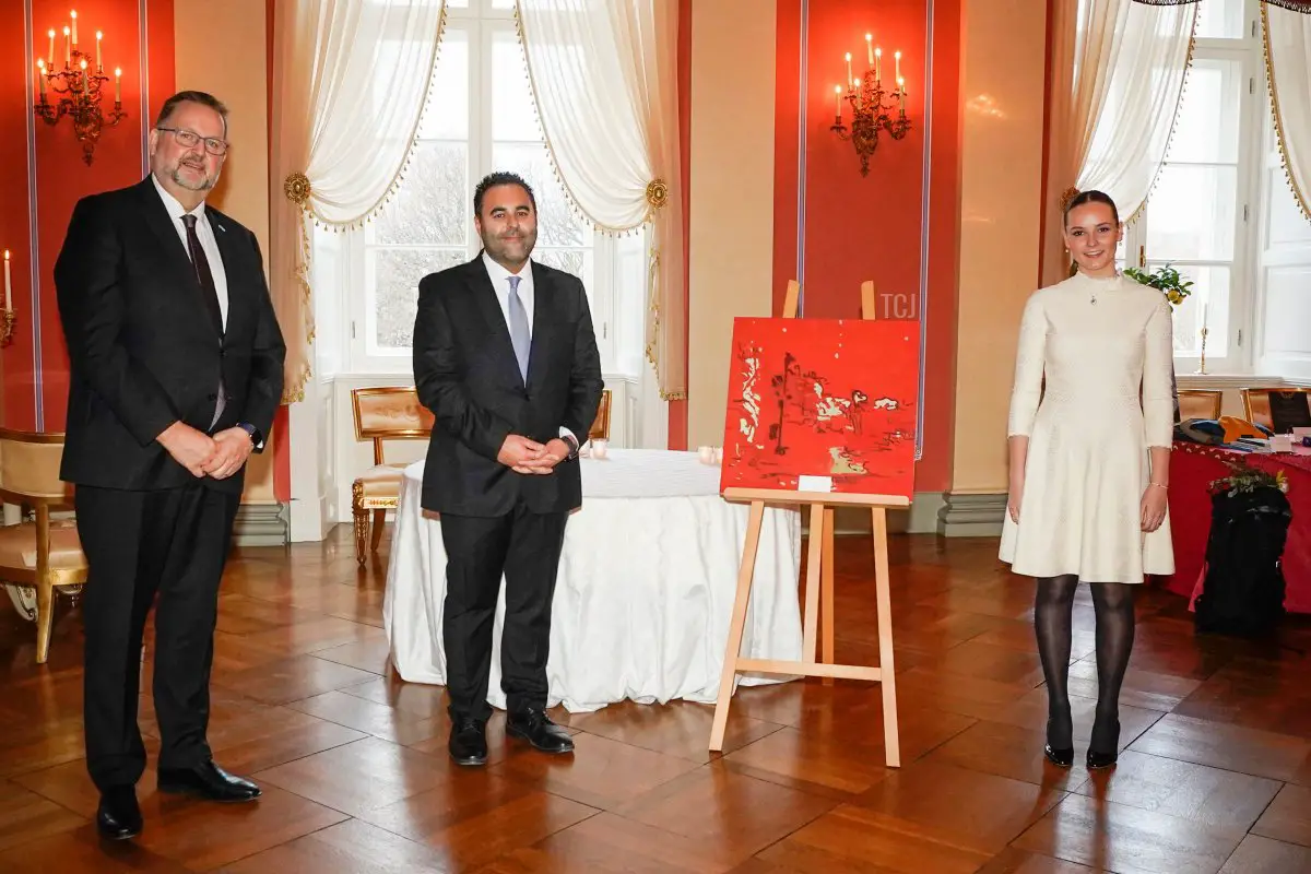 Princess Ingrid Alexandra of Norway (R) poses with the President of the Norwegian Parliament Masud Gharahkhani (C) and First Vice President Svein Harberg next to the painting 