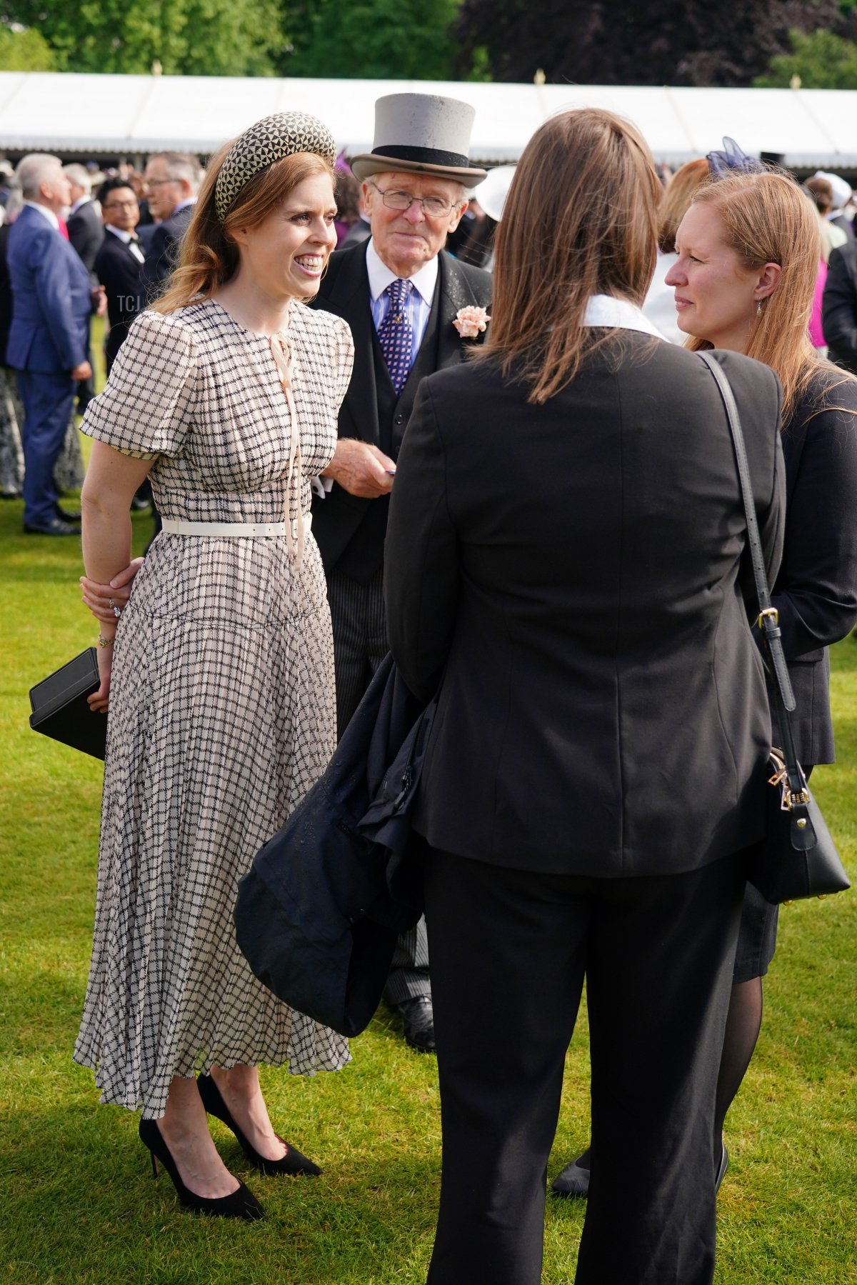 Princess Beatrice of York speaks to guests at a Royal Garden Party at Buckingham Palace on May 25, 2022 in London, England