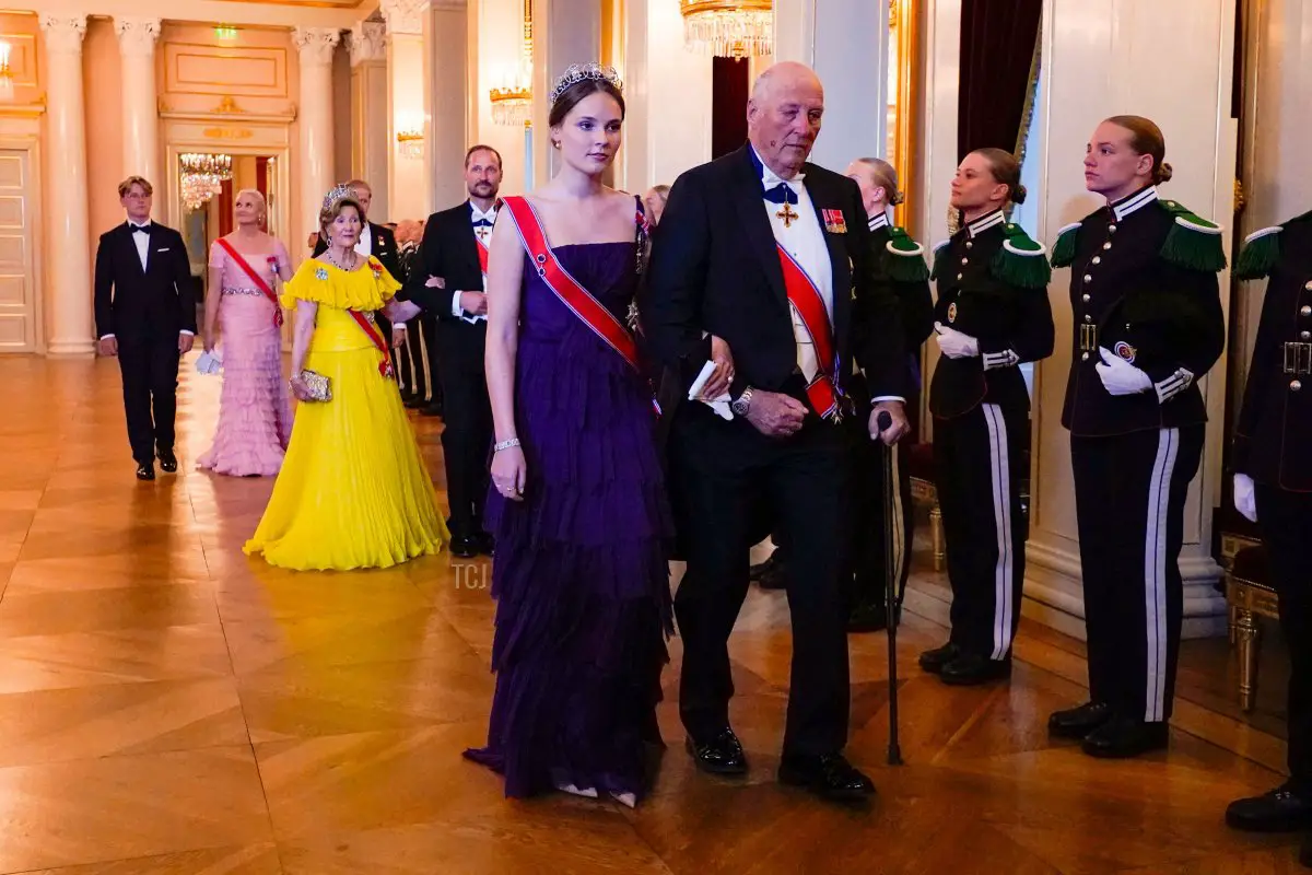 Norway's Princess Ingrid Alexandra accompanies Norway's King Harald V to The Great Hall before a gala dinner for her 18th birthday at the Palace in Oslo on June 17, 2022. - Princess Ingrid Alexandra turned 18 on January 21, 2022