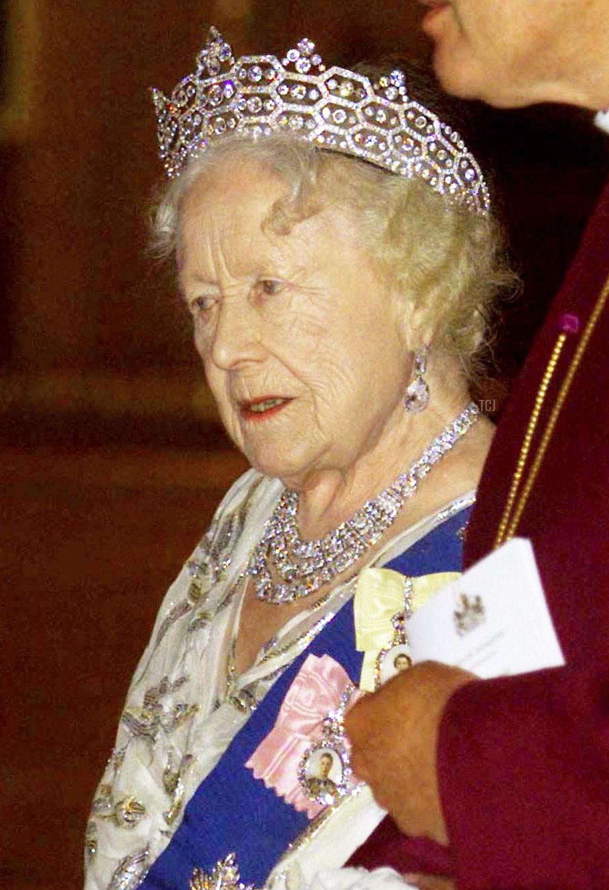 The Queen Mother walks with the Archbishop of Canterbury George Carey as they enter the Waterloo Chamber prior to the State Dinner held at Windsor Castle for German President Roman Herzog this evening 01 December 1998