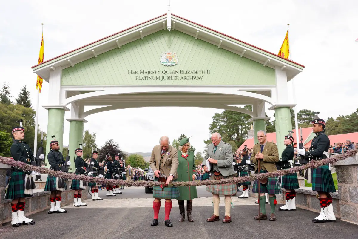 Prince Charles, Prince of Wales, known as the Duke of Rothesay when in Scotland cuts a 'heather rope' to officially open The Queen Elizabeth Platinum Jubilee Archway structure during the Braemar Highland Gathering at the Princess Royal & Duke of Fife Memorial Park on September 03, 2022 in Braemar, Scotland