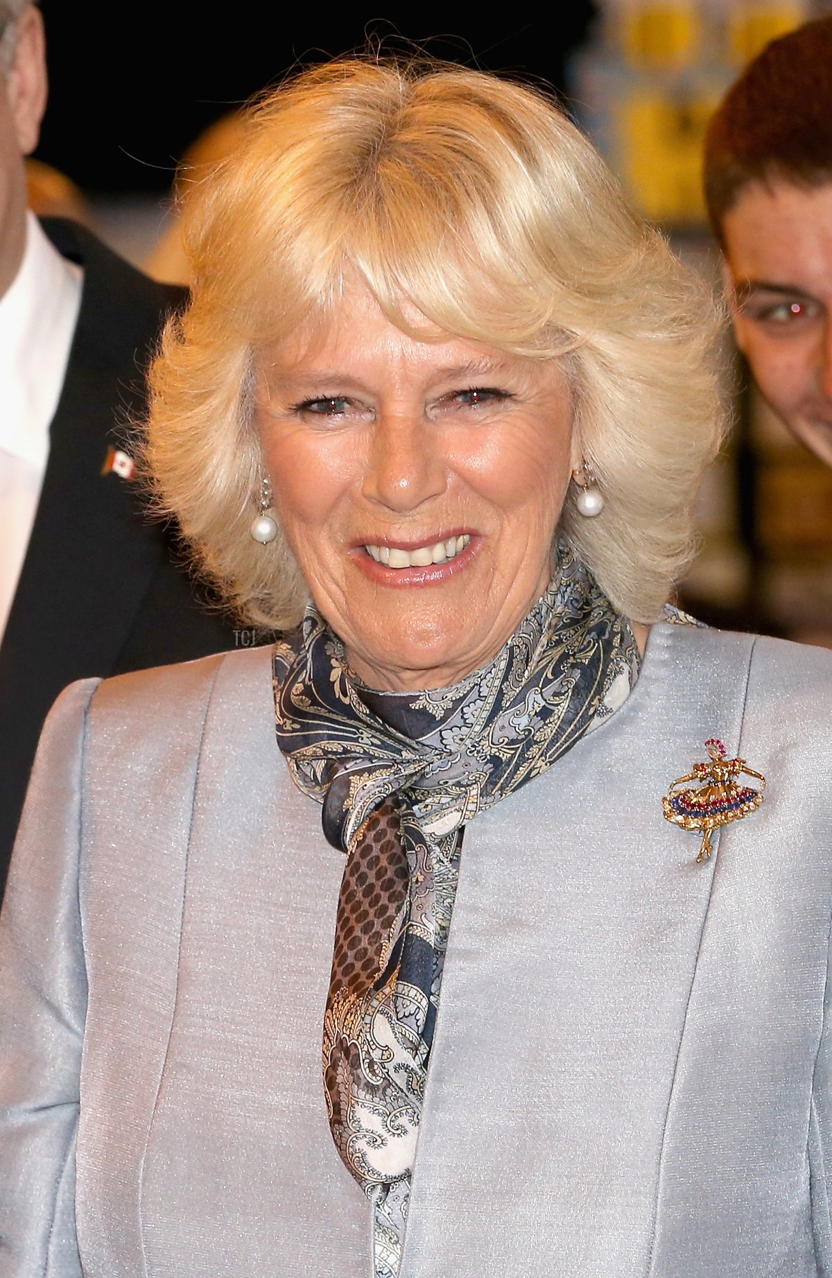 Camilla, Duchess of Cornwall laughs as she visits Stevenson Campus Air Hanger on May 21, 2014 in Winnipeg, Canada