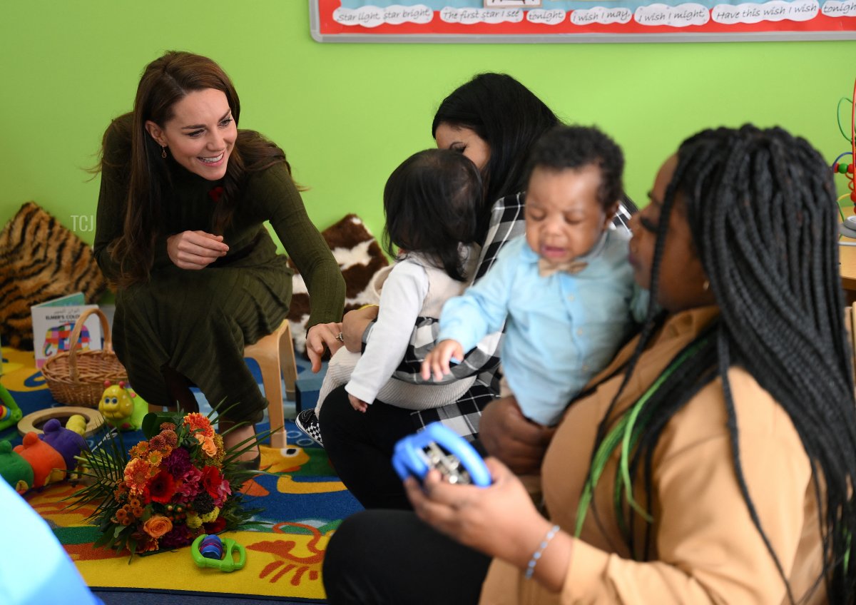 Britain's Catherine, Princess of Wales talks with parents and children during her visit to Colham Manor Children's Centre in Hillingdon, west London, on November 9, 2022