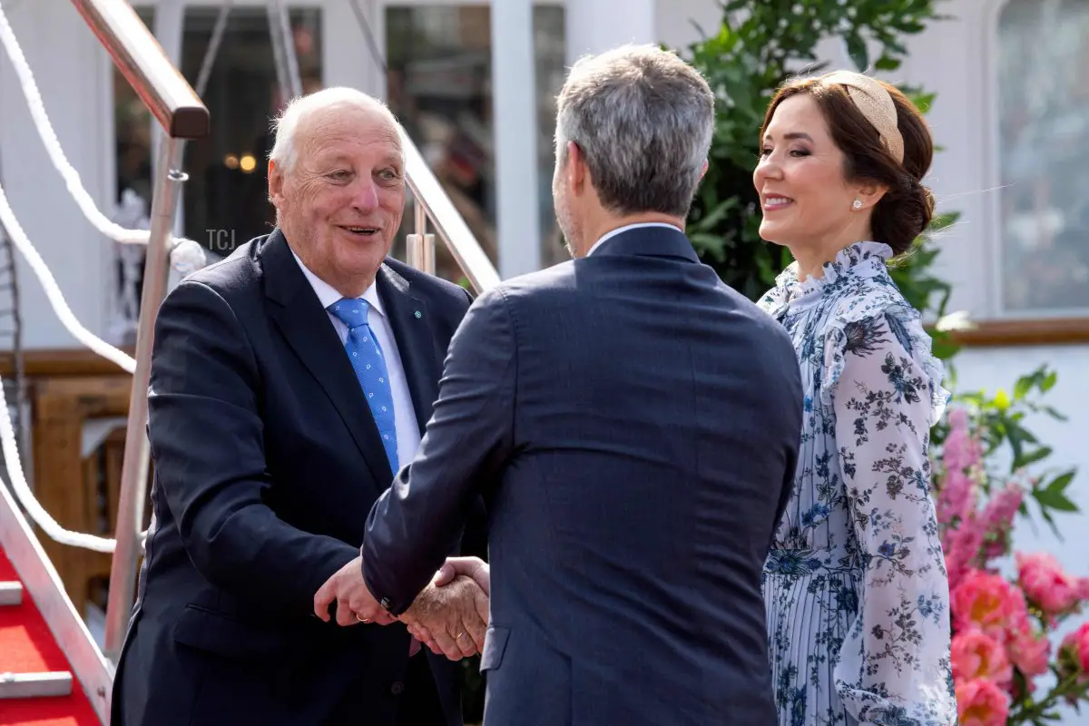 King Harald V of Norway is welcomed by Crown Prince Frederik and Crown Princess Mary of Denmark upon leaving the royal Norwegian ship Norge at Aarhus Harbor on June 16, 2023 (BO AMSTRUP/Ritzau Scanpix/AFP via Getty Images)