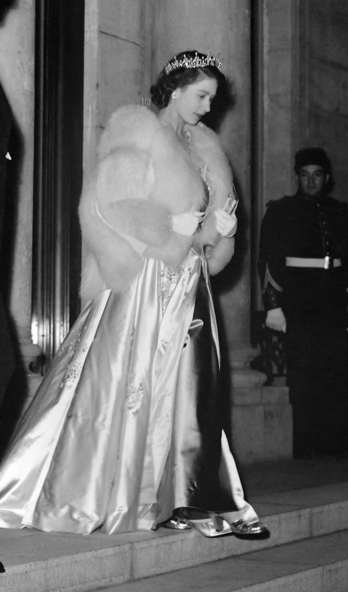 Princess Elizabeth of the United Kingdom, wearing an evening gown and a tiara, leaves the Elysee Palace in Paris on May 14, 1948 (AFP via Getty Images)