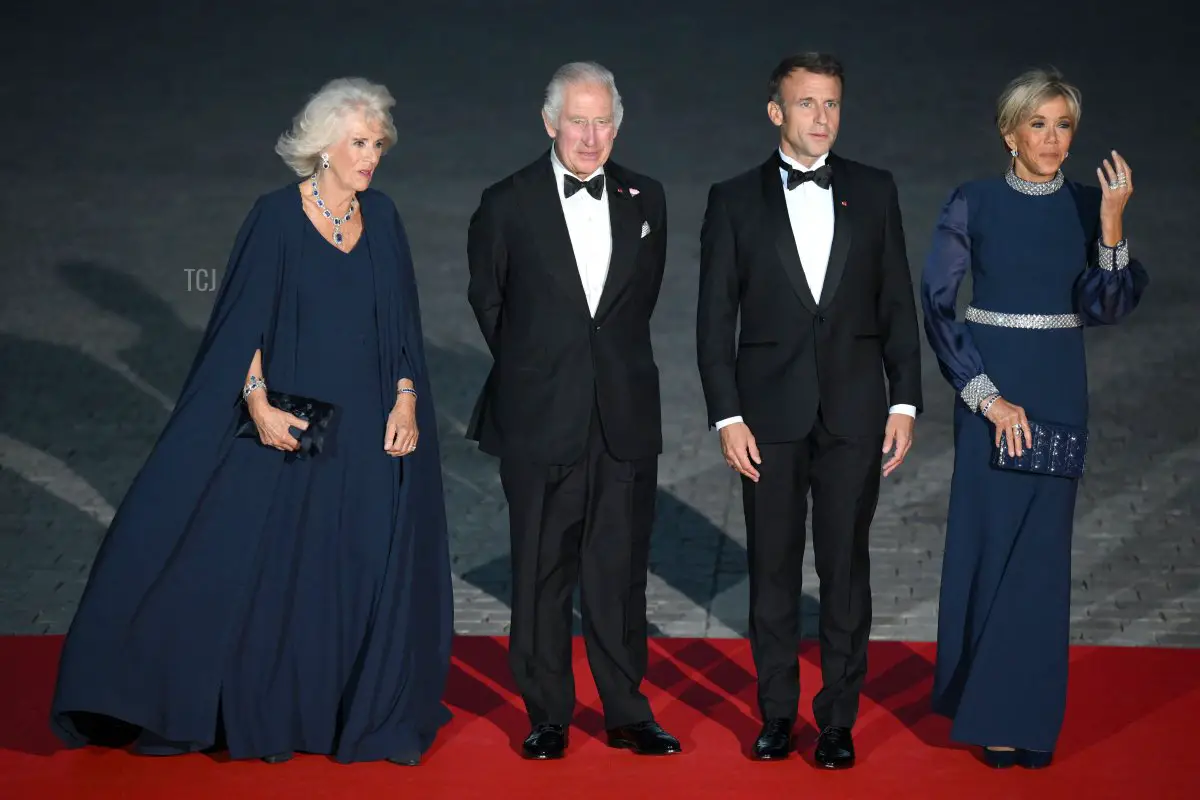 King Charles III and Queen Camilla arrive with President Emmanuel Macron and his wife, Brigitte, for a state dinner at the Palace of Versailles during the British state visit to France, September 20, 2023 (DANIEL LEAL/AFP via Getty Images)