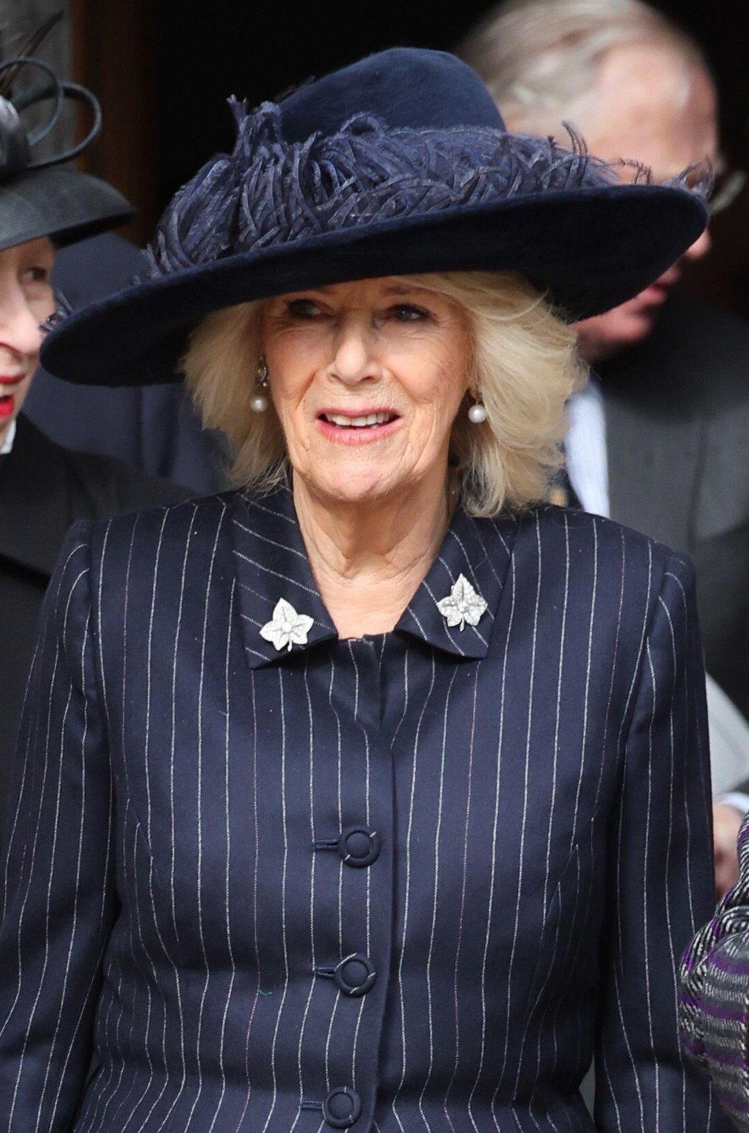 La Regina Camilla del Regno Unito parte dopo un servizio commemorativo in onore del compianto Re Costantino II di Grecia presso la Cappella di San Giorgio, Windsor il 27 febbraio 2024 (Chris Jackson/PA Images/Alamy)