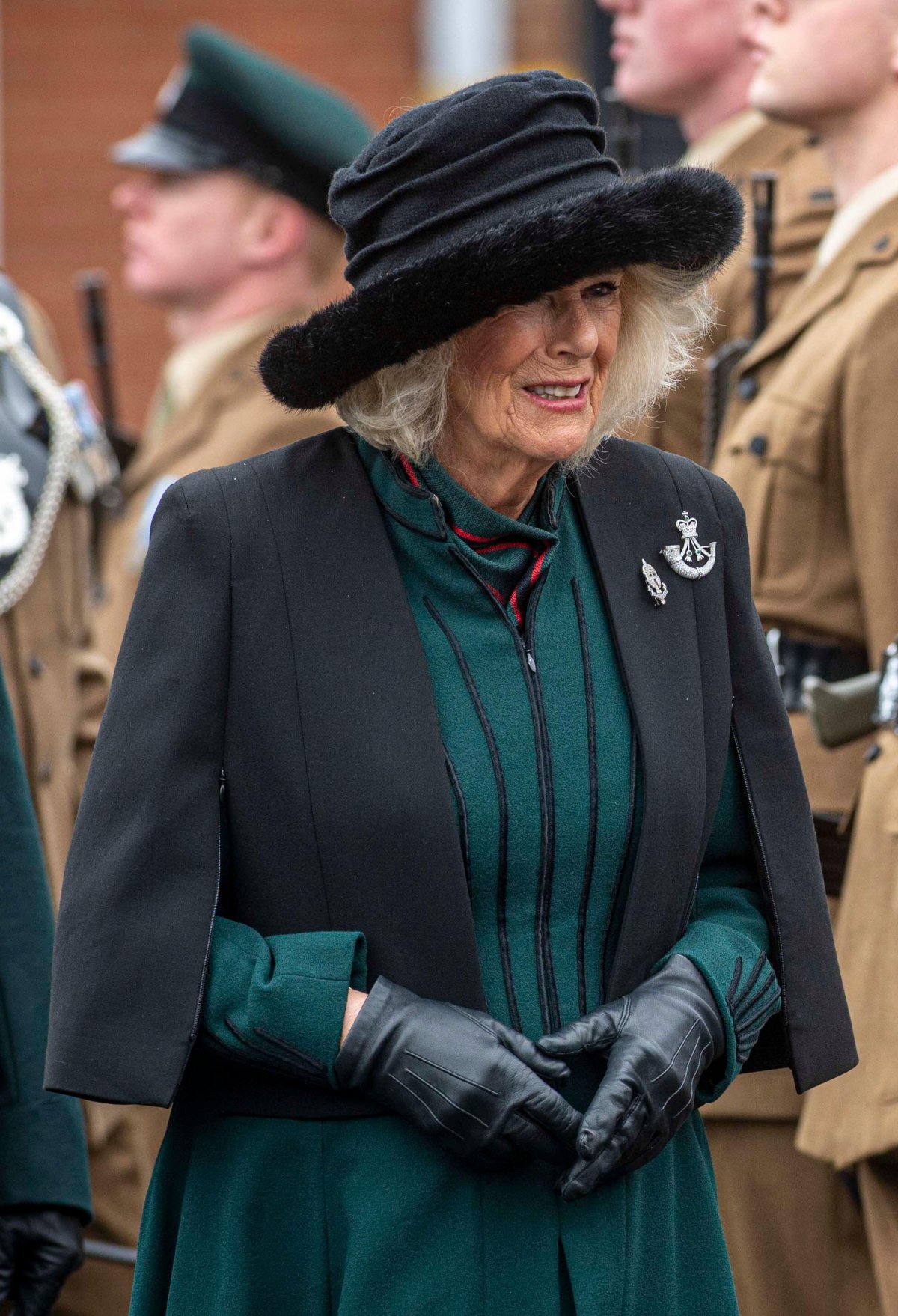 Queen Camilla of the United Kingdom inspects riflemen during a parade at Thiepval Barracks in Lisburn in County Antrim on March 21, 2024 (Mark Owens/UK MOD Crown copyright/PA Images/Alamy)