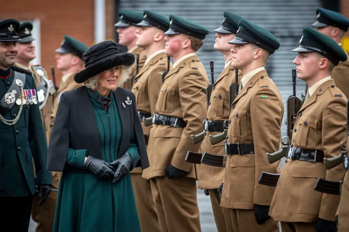 Queen Camilla of the United Kingdom inspects riflemen during a parade at Thiepval Barracks in Lisburn in County Antrim on March 21, 2024 (Mark Owens/UK MOD Crown copyright/PA Images/Alamy)