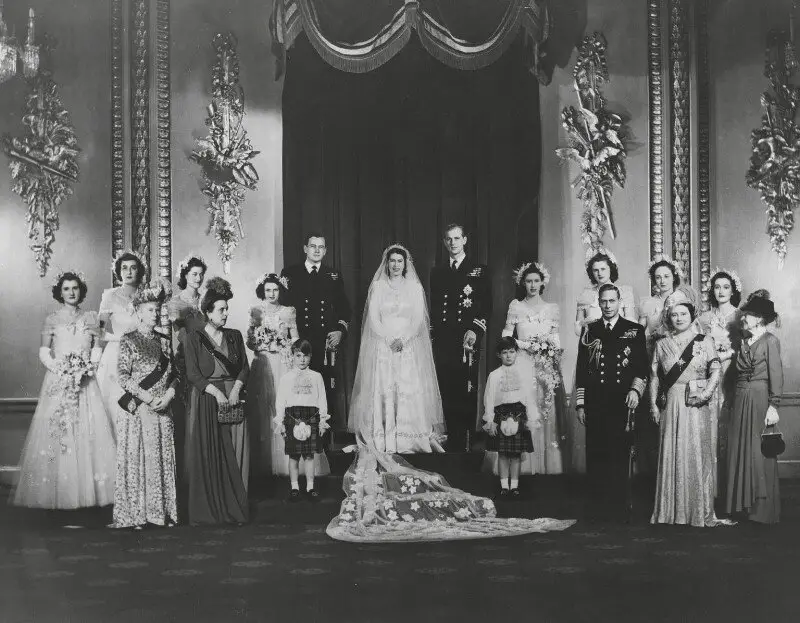 Princess Elizabeth and Prince Philip pose with their bridal party, parents, and grandparents on their wedding day at Buckingham Palace on November 20, 1947 (Vandyk/© National Portrait Gallery, London)