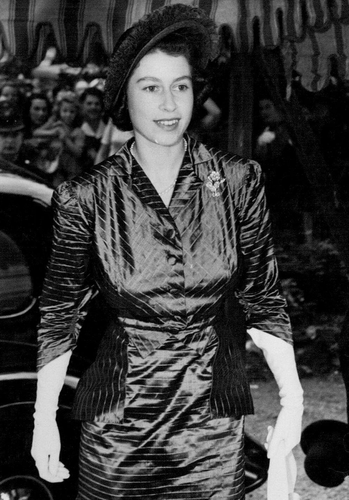 Princess Elizabeth attends the wedding of Lady Elizabeth Lambart and Mark Longman at St. Peter's, Eaton Square in London on July 20, 1949 (SuperStock/Alamy)