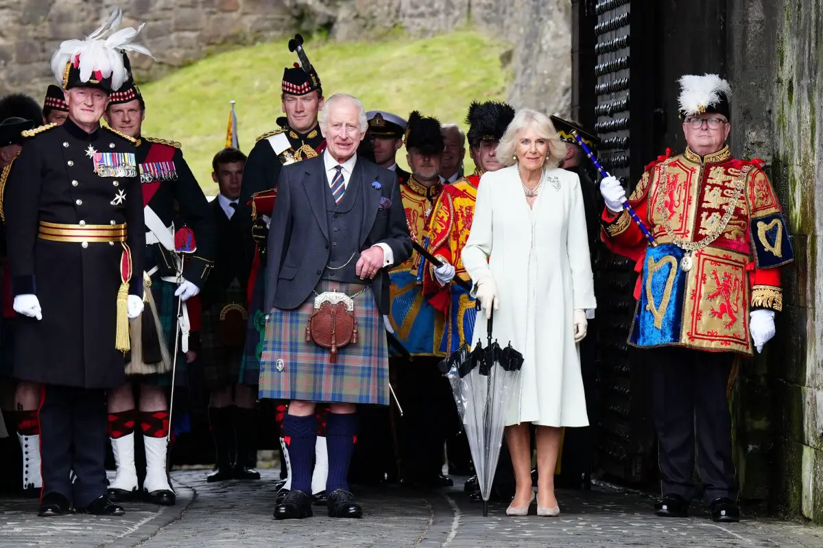 King Charles III and Queen Camilla, with Major General Alastair Bruce and Lord Lyon, participate in the celebration for the 900th anniversary of Edinburgh at Edinburgh Castle on July 3, 2024 (Jane Barlow/PA Images/Alamy)