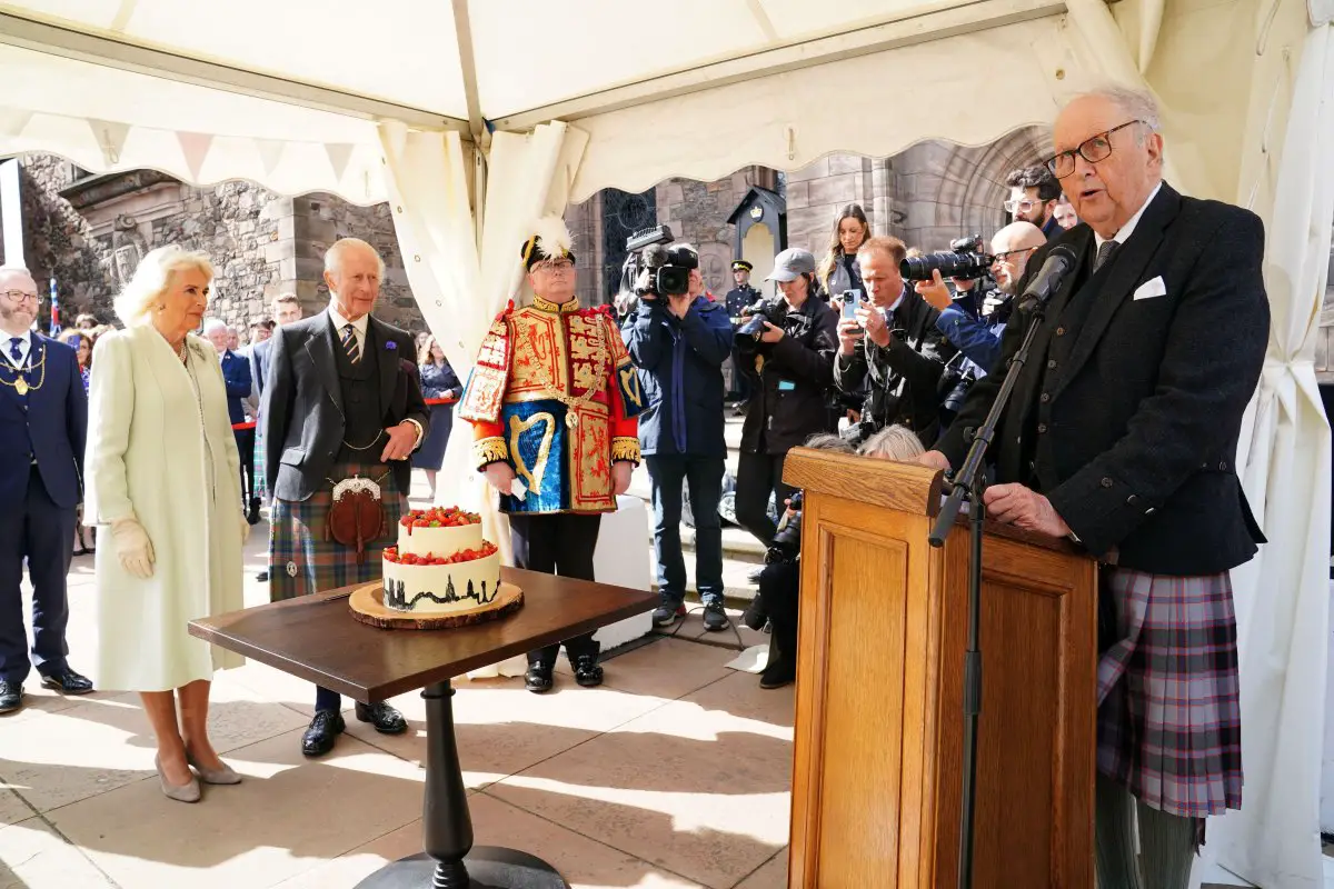 King Charles III and Queen Camilla attend a celebration marking the 900th anniversary of the city of Edinburgh at Edinburgh Castle on July 3, 2024 (Jane Barlow/PA Images/Alamy)