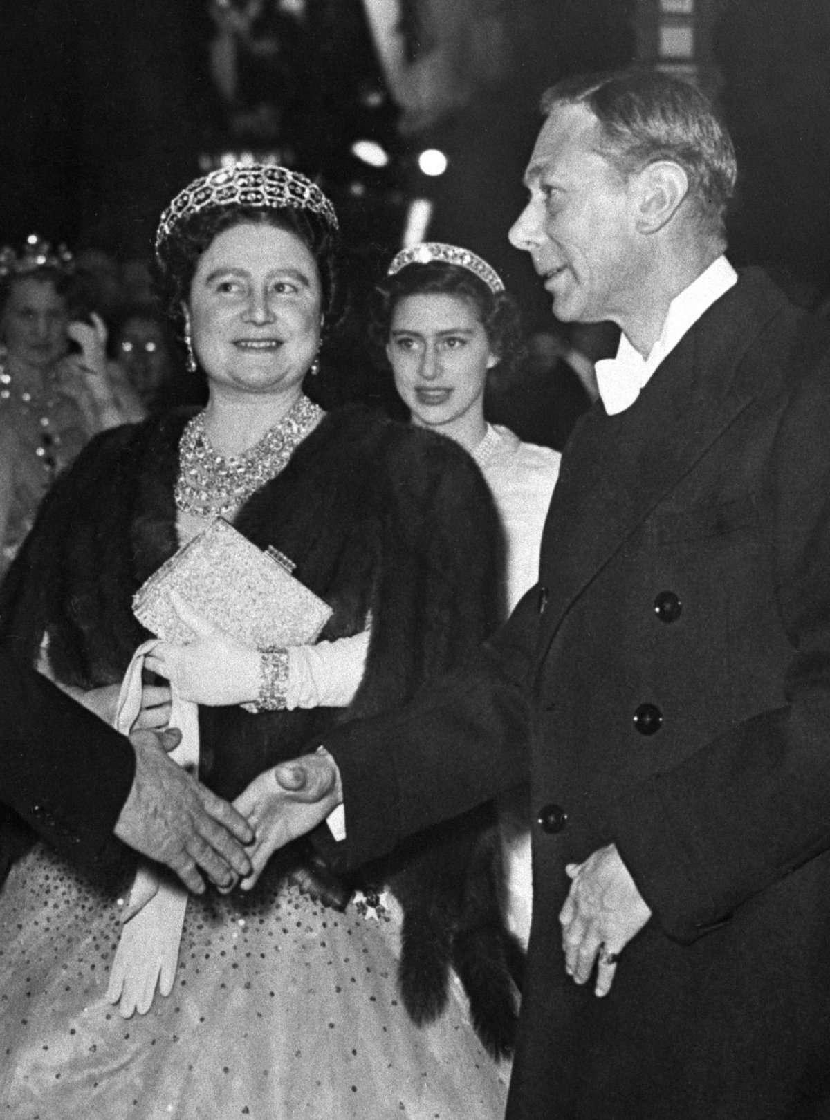 King George VI and Queen Elizabeth of the United Kingdom, with Princess Margaret, arrive for a return dinner at Claridge's in London during the Dutch state visit, November 1950 (PA Images/Alamy)