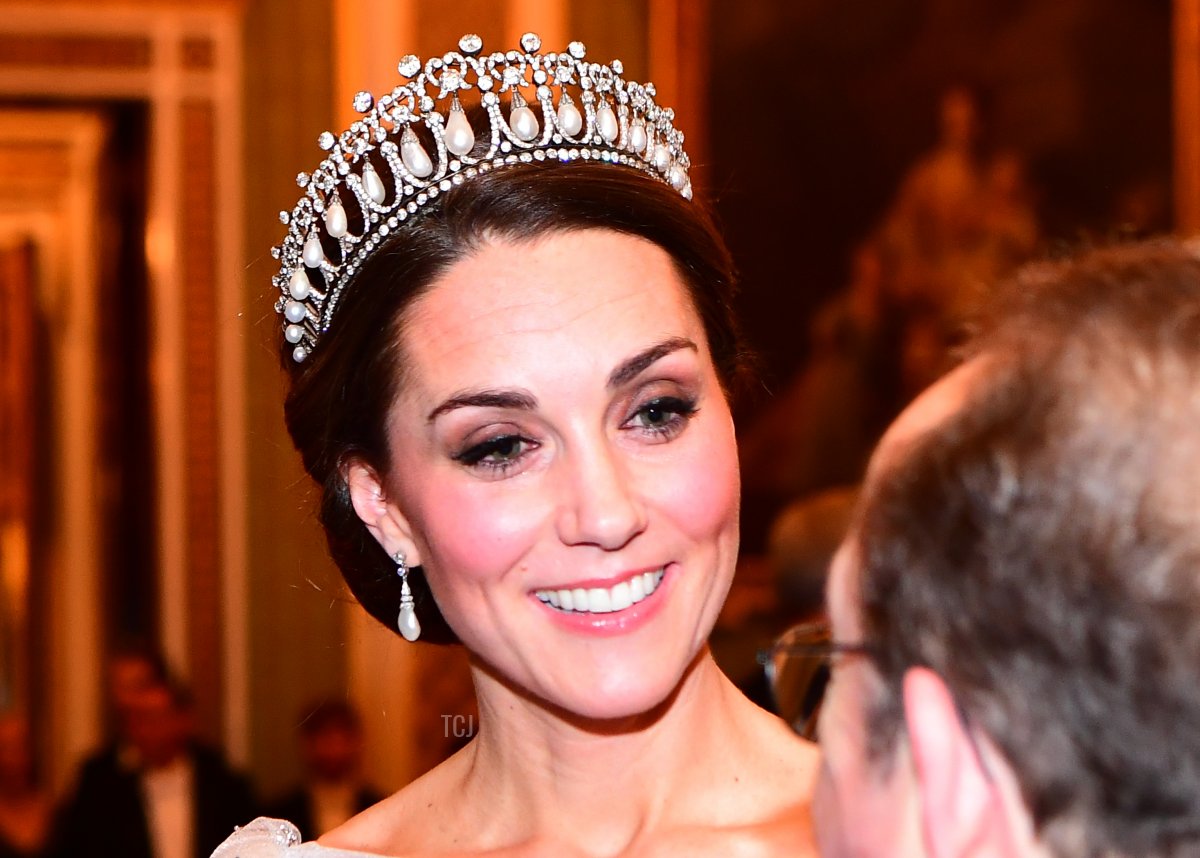 Catherine, Duchess of Cambridge greets guests at an evening reception for members of the Diplomatic Corps at Buckingham Palace on December 04, 2018 in London, England